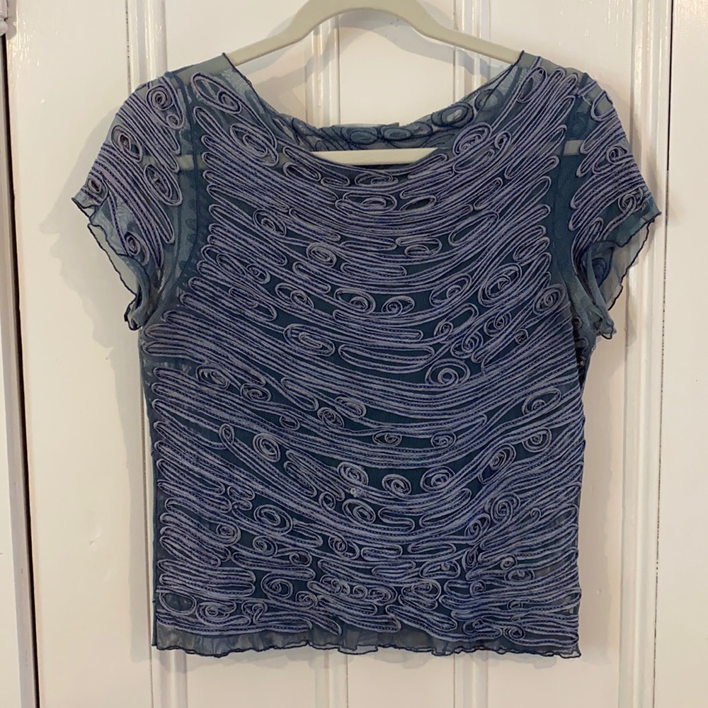 Stunning & unique blouse with exquisite detail. Really one of a kind.